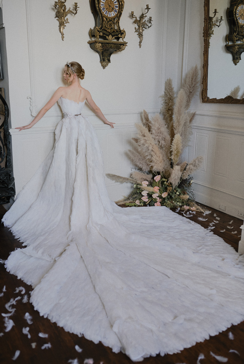 Bride ballerina in a feathered white ballgown in Perfect Wedding Magazine