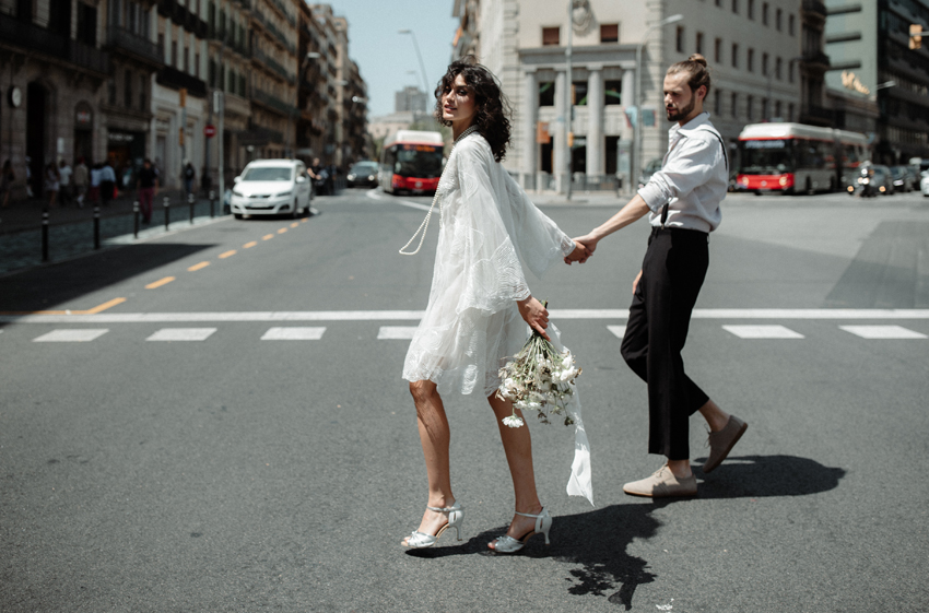 Bride and Groom walking in the streets of Barcelona an elopement inspiration