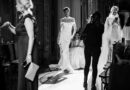 model wearing a wedding dress backstage from the fashion show